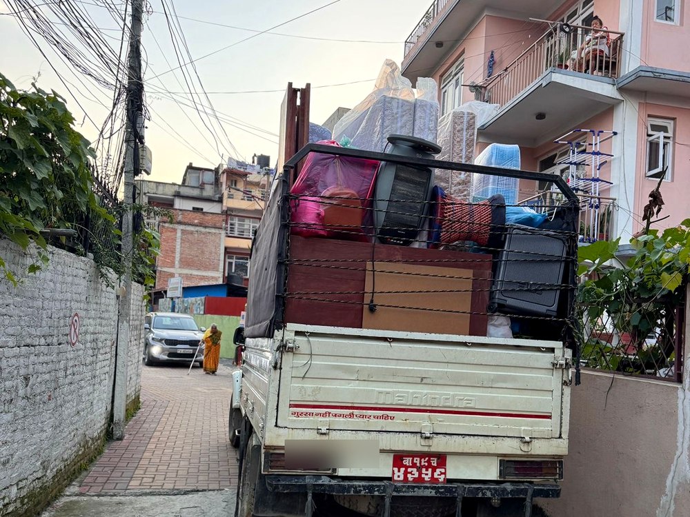 Moving truck loaded with household items in Kathmandu